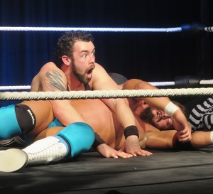 “The Winner” P.J. Jones (heel) going for a pinfall against Plymouth Wrestler Eddie Ryan “The English Lion” (face).  Photography G H Bennett