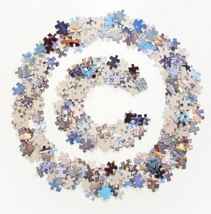 Copyright sign made of jigsaw puzzle pieces separated