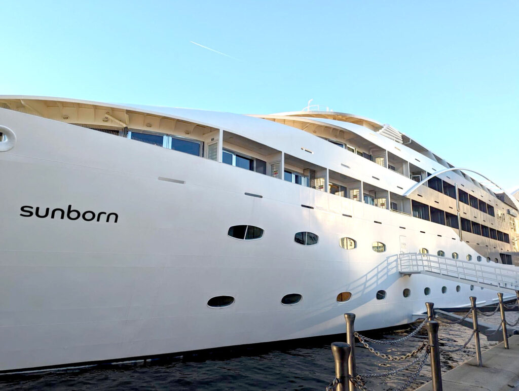 A larger wite Yacht - The Sunborn Yacht hotel, fills the frame.