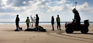 Researchers on the beach